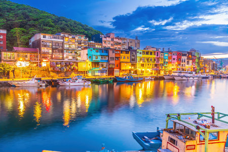 Cityscape of Colorful Zhengbin Fishing Port  in Keelung near Taipei city, Taiwan at sunsetの写真素材