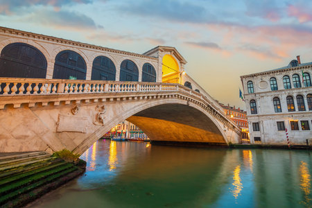 Panoramic view of famous Canal Grande with famous Rialto Bridge at sunset in Veniceの写真素材