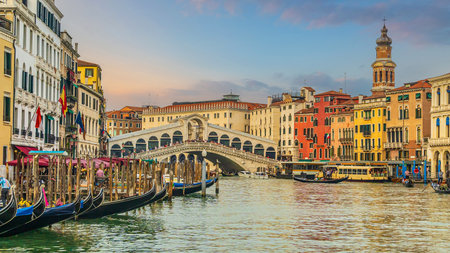 Panoramic view of famous Canal Grande with famous Rialto Bridge at sunset in Veniceの写真素材