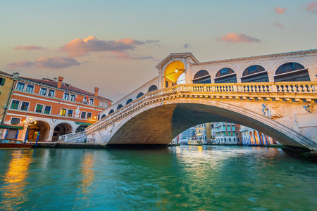 Panoramic view of famous Canal Grande with famous Rialto Bridge at sunset in Veniceの写真素材