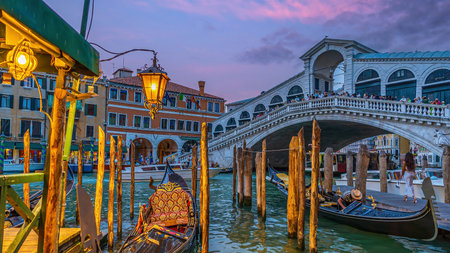 Panoramic view of famous Canal Grande with famous Rialto Bridge at sunset in Veniceの写真素材