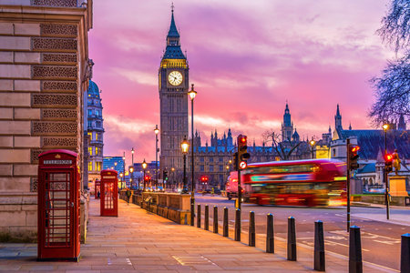 Big Ben tower of Houses of Parliament with telephone booth, Westminster in London, UK at sunriseの写真素材