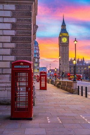 Big Ben tower of Houses of Parliament with telephone booth, Westminster in London, UK at sunriseの写真素材