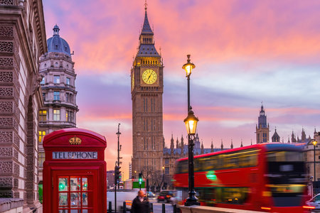 Big Ben tower of Houses of Parliament with telephone booth, Westminster in London, UK at sunriseの写真素材