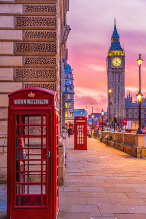 Big Ben tower of Houses of Parliament with telephone booth, Westminster in London, UK at sunriseの写真素材