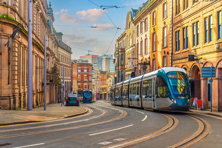 Tram in downtown Nottingham city, cityscape of England at twilightの写真素材