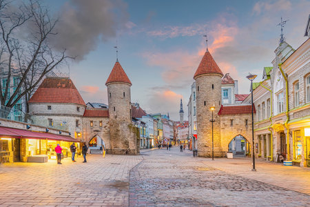 Twin towers of Viru Gate in Old town Tallinn, cityscape of Estonia at sunsetの写真素材