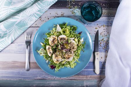 Gourmet salad with seeds, vinaigrette sauce, olives and mushrooms. Healthy summer mealの写真素材