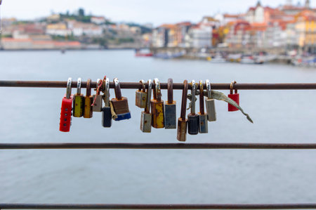 Colorful love padlocks on metal bridge in Portugal Porto Padlock Dom Luis I Bridge Portoの写真素材