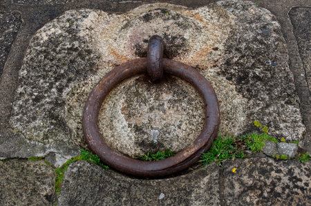 Old rusty iron ring on the stone wall. Old rusty ring.の写真素材
