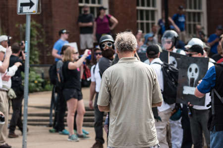 Charlottesville, Virginia USA August 12, 2017 Man in crowd as UTR members attempt to enter Emancipation ( Lee ) Park for rally while activists protesting rally block entranceのeditorial素材