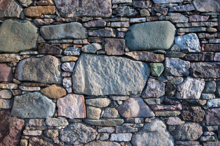Native green basalt stone formed in Piscean Age used in building foundation for old homeの写真素材