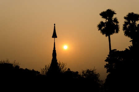 Silhouette top of temple with sunsetの写真素材