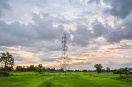 Single electic pole in front of beatiful sun setting