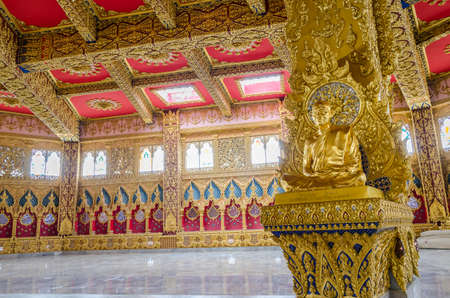Neat asian golden sculpture monk is meditating quietlyの写真素材