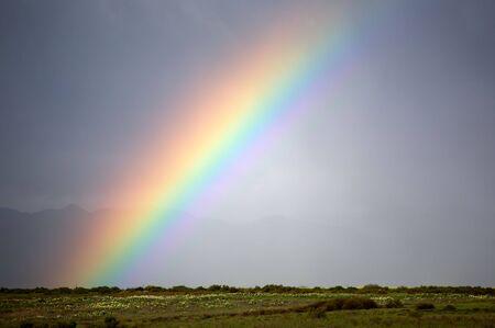 A rainbow in the sky as a landscape.の写真素材