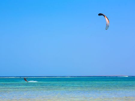 sea landscape with kiteman in moving.の写真素材