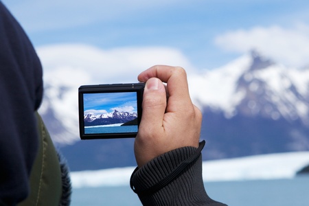 Man photographing mountains.の写真素材