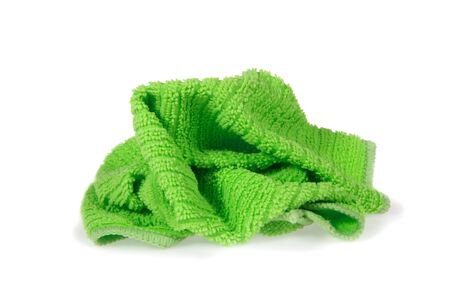 Used crumpled green rag isolated on white backgroundの写真素材