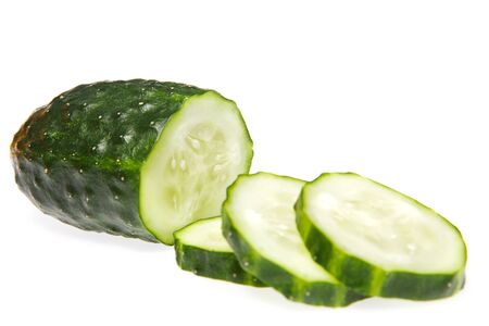 Cucumber and three slice isolated on white backgroundの写真素材