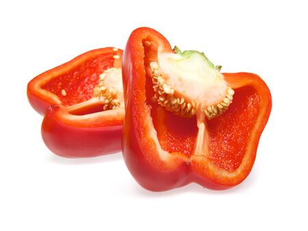 Two half red pepper isolated on white background with shadowの写真素材
