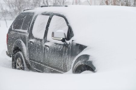 A car buried in snow in the winter.の写真素材