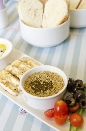 A very healthy Lebanese breakfast with bread, zaatar spread, hallumi cheese, olives and tomatoes  Very typical dish of lebanon and Mediterranean cuisine の写真素材
