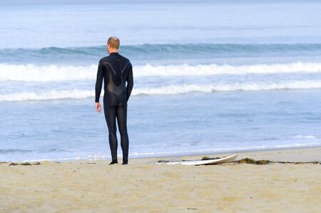 An American surfer boy in the Pacific beach in San Diego, Southern California, in the United States...