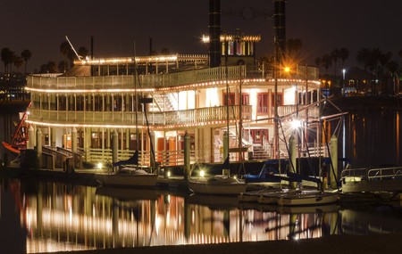 Night view of an authentic, vintage, American riverboat with two chimneys resembling the steamboats used in the 1800s in Mississippi river. A view of Mission Bay and pier in San Diego, southern California, USA.の写真素材