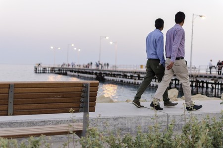The Limassol pier in Old Port and Molos Area in Cyprus. A dusk view of the wooden pier, benches,...