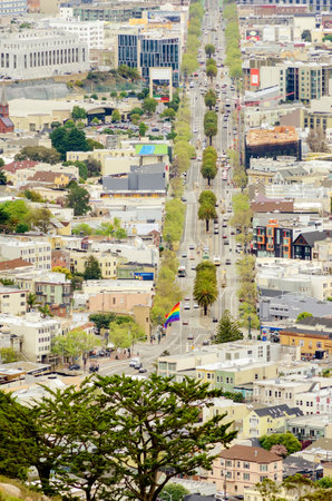 Aerial view of Market street in the Castro, San Francisco, California, United States of America. View of the avenue, LGBT rainbow flag waving, cityscape and Castro area from Twin Peaks.のeditorial素材