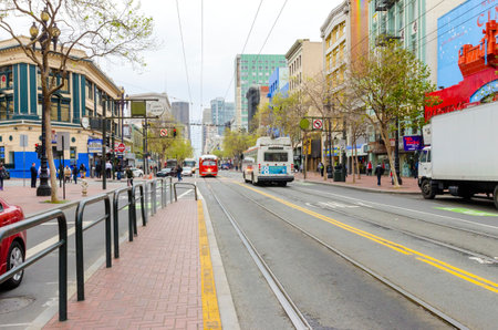 Market street in Downtown and South in San Francisco city, California, United States of America. A view of the road transport, shops, architecture, cable car lines and cityscapeのeditorial素材