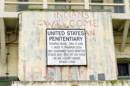 The old sign on Alcatraz Penitentiary island, now a museum, in San Francisco, California, USA, which was painted with red graffiti by Indians during the native American occupation.のeditorial素材