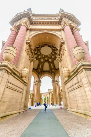 A view of the dome rotunda of the Palace of Fine Arts in San Francisco, California, United States of America. A colonnade roman greek architecture with statues and sculptures build around a lagoon.のeditorial素材
