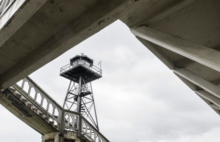 The old Guard Tower on Alcatraz Penitentiary island, now a museum, in San Francisco, California, USA. A view of the watchtower and a staircase leading to the barracks, Building 64.のeditorial素材