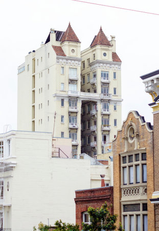 Exterior detail of victorian architecture houses in San Francisco, California, United States of America. A view of a block of flats with towersのeditorial素材