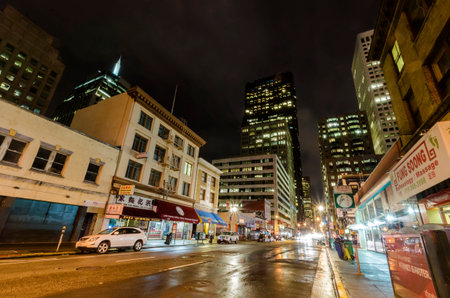 Night view of San Francisco Chinatown in northern California, United States of America. A view of the cityscape, city skyscrapers, illuminated streets and Chinese signs over the shops.のeditorial素材