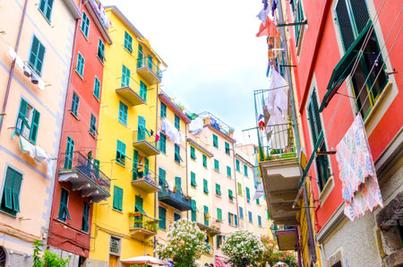 Riomaggiore village, La Spezia province, Liguria, northern Italy. View of the colourful houses on steep hills and laundry on balconies. Part of the Cinque Terre National Park and a UNESCO World Heritage Site.のeditorial素材