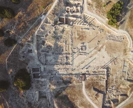 Aerial view of Amathounta ruins and columns at ancient greek roman archaeological site at Agios Tychonas, Limassol, Cyprus. Amathus royal city remains from above by Mediterranean sea.の写真素材