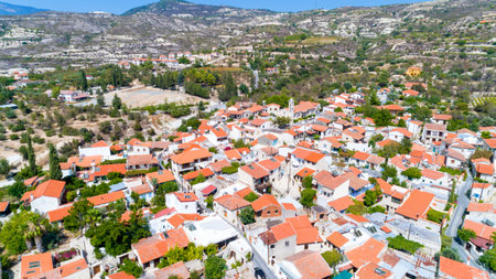 Aerial Lania (Laneia) wine village, Limassol, Cyprus. Bird's eye view of traditional Mediterranean, picturesque alleys, red ceramic roof tile houses, vineyards, church and entrance.のeditorial素材