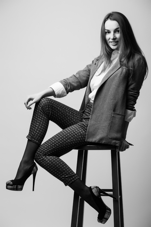Young lady on the chairの写真素材