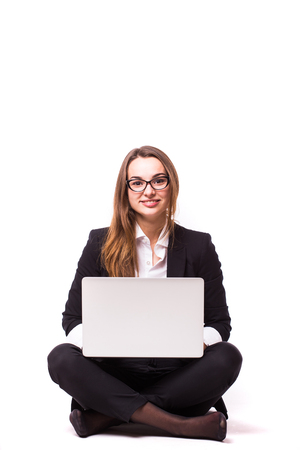 Businesswoman use of laptop computer. Isolated on white background.の写真素材