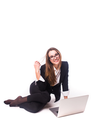 Businesswoman use of laptop computer. Isolated on white background.の写真素材