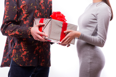 Close-up of couple hands holding a presentの写真素材