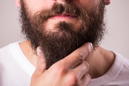 portrait of beard against white backgroundの写真素材