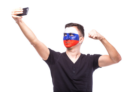 Selfie on phone of Russian football fans in game supporting of Russia national teams on white background. European football fans concept.の写真素材