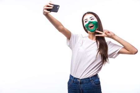 Selfie on phone of Welsh football fans in game supporting of Wales national teams on white background. European football fans concept.の写真素材