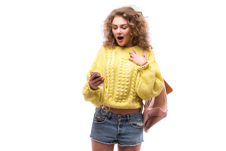 Girl  using earphones from smart phone, listening to music or talking to someoneの写真素材