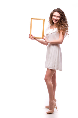 Happy smiling woman demonstrate frame, over white backgroundの写真素材