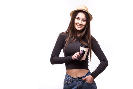 Portrait of happy beauty girl in sunglasses drink tea or coffee from paper cup on white background.の写真素材
